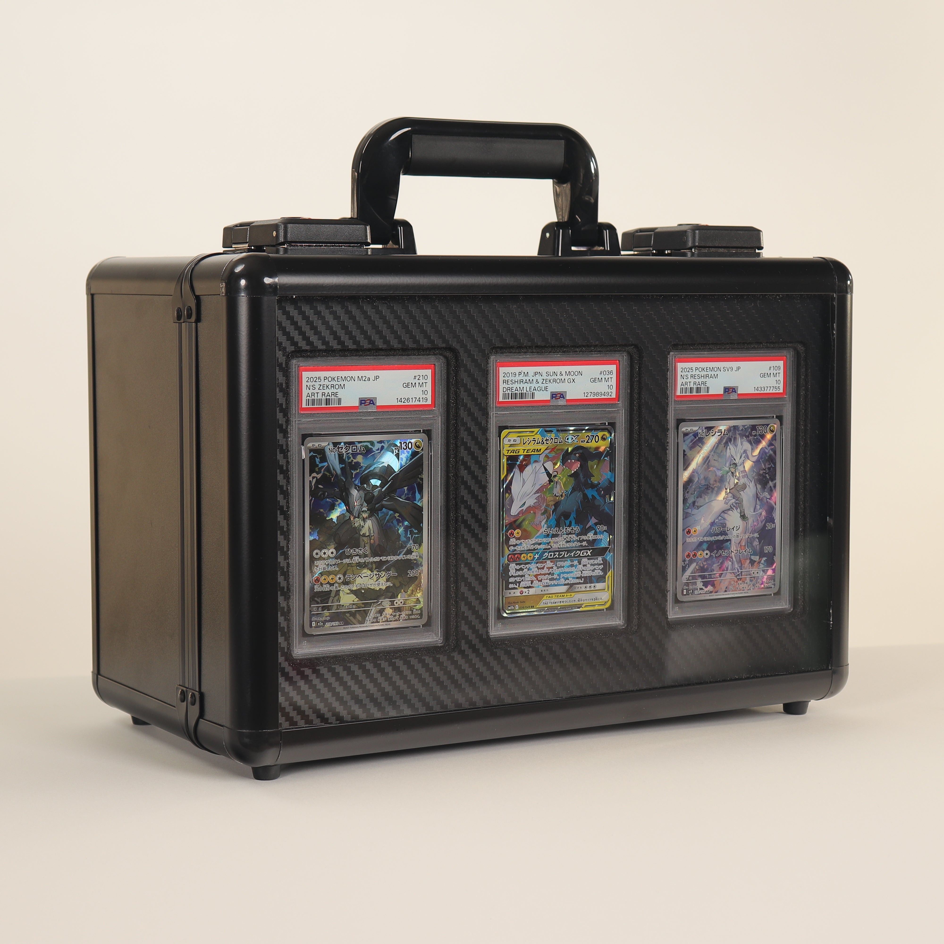 Black carrying case with three trading card packs on a beige background