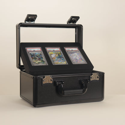 Black display case with glass top holding trading cards on a beige background