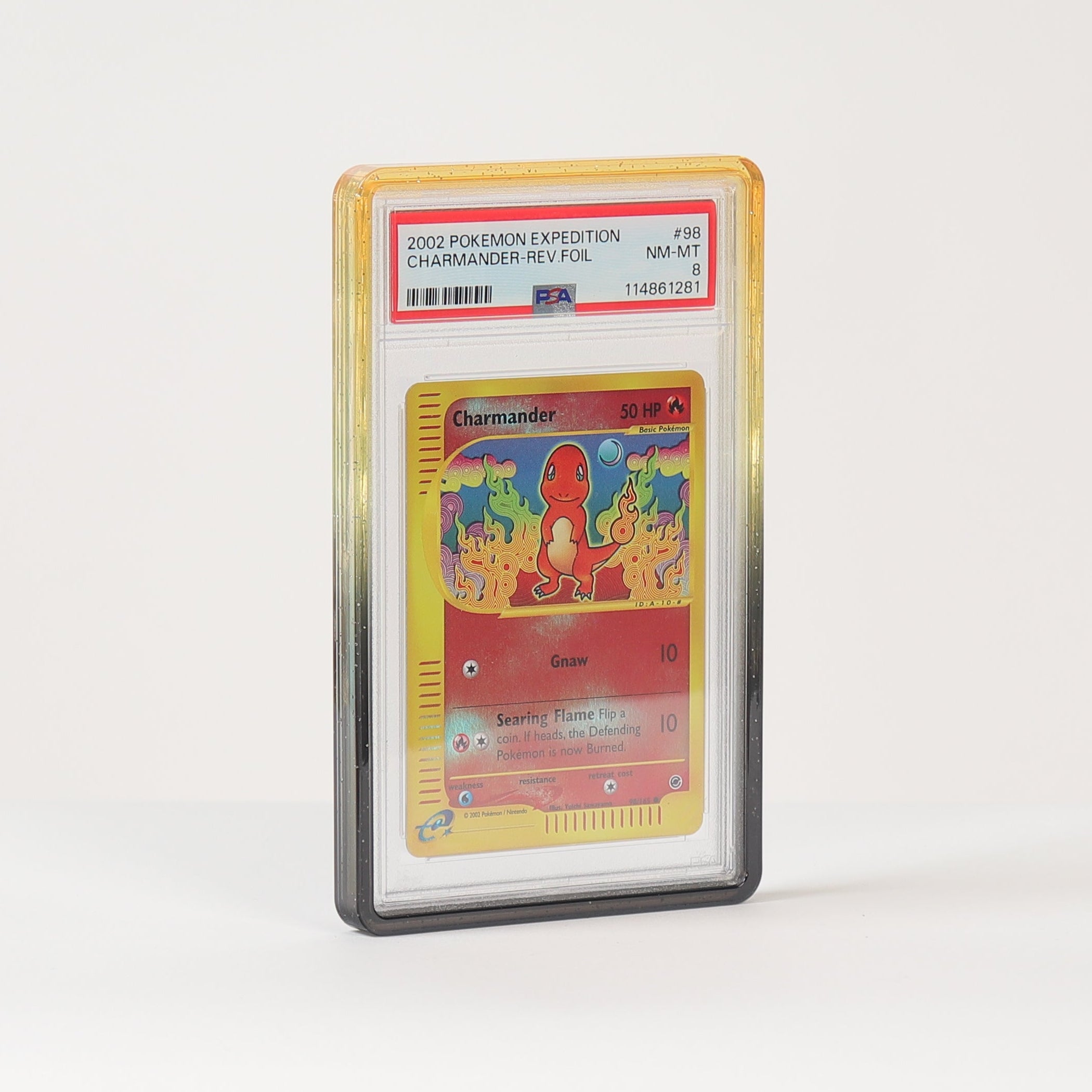 A graded holographic Pokémon TCG card, specifically a 2011 Charizard hologram, encapsulated in a PSA grading sleeve and standing upright on a white surface against a white background.