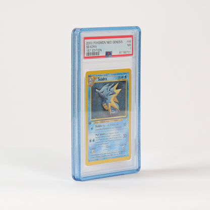A graded Pokémon TCG card in a clear PSA-style plastic slab, standing upright on a white studio surface against a white background.